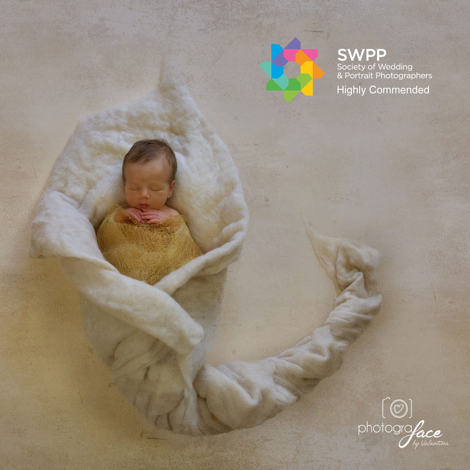 Baby posed and sleeping during a newborn photography session with award winning newborn photographer Clapham London