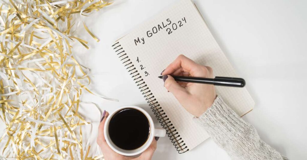 flat lay image of a blank notebook to write 2024 goals